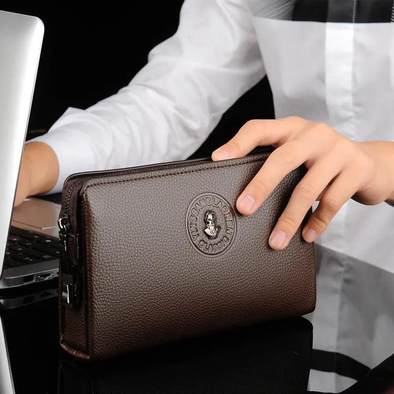 Men's business casual clutch made of soft PU leather, black, with visible sewing line detail and anti-theft design