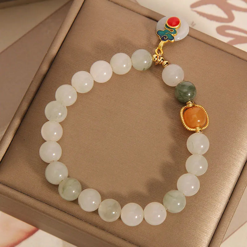 Women's ice jade crystal bracelet with pearl elements and xiangyun peace jade buckle