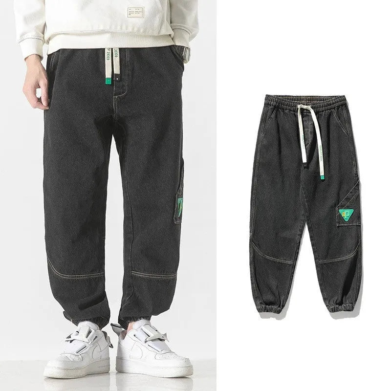 Men's loose-fit tapered cotton trousers in black, available in sizes from M to 8XL