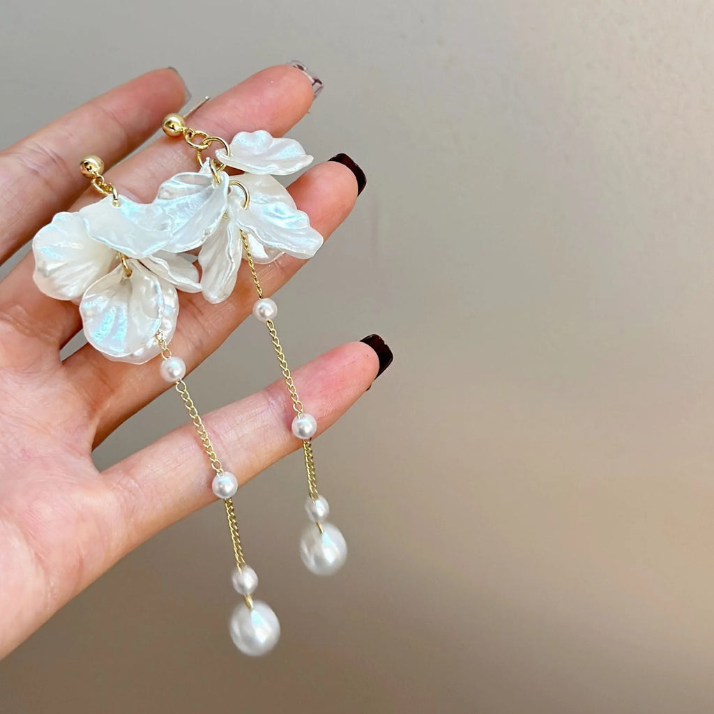 Women's acrylic shell pearl tassel earrings showing 8.8cm drop length and cushion ear clip option