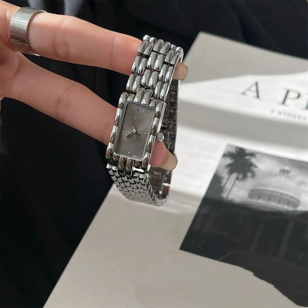 Women's mid-century inspired bracelet watch with 15mm dial and butterfly clasp in silver and gold colour options
