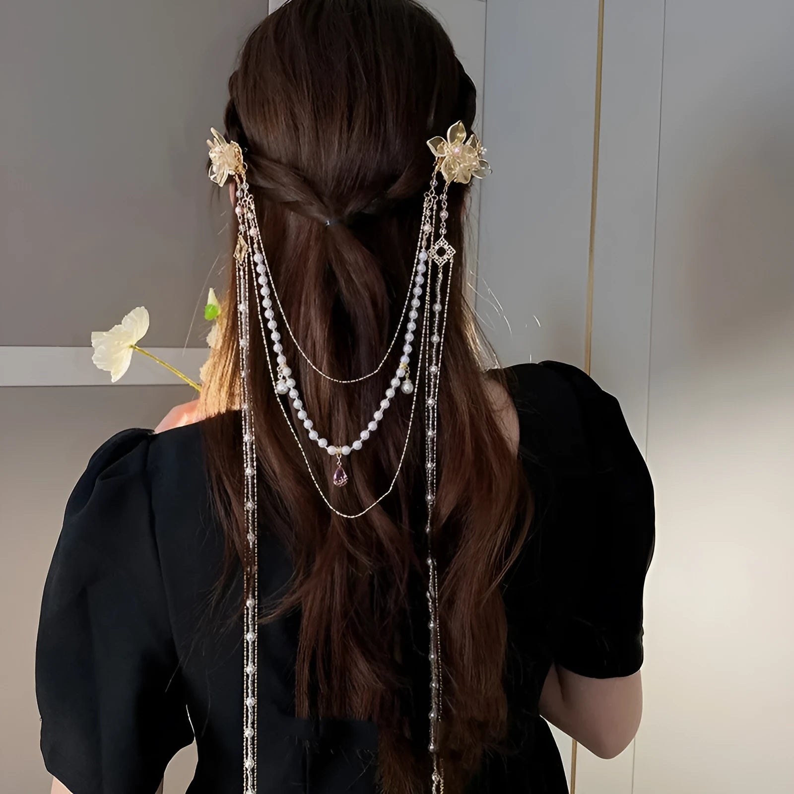 Gold acrylic hairpin with pearl, diamond, and long tassel decorative elements for women's hairstyling.