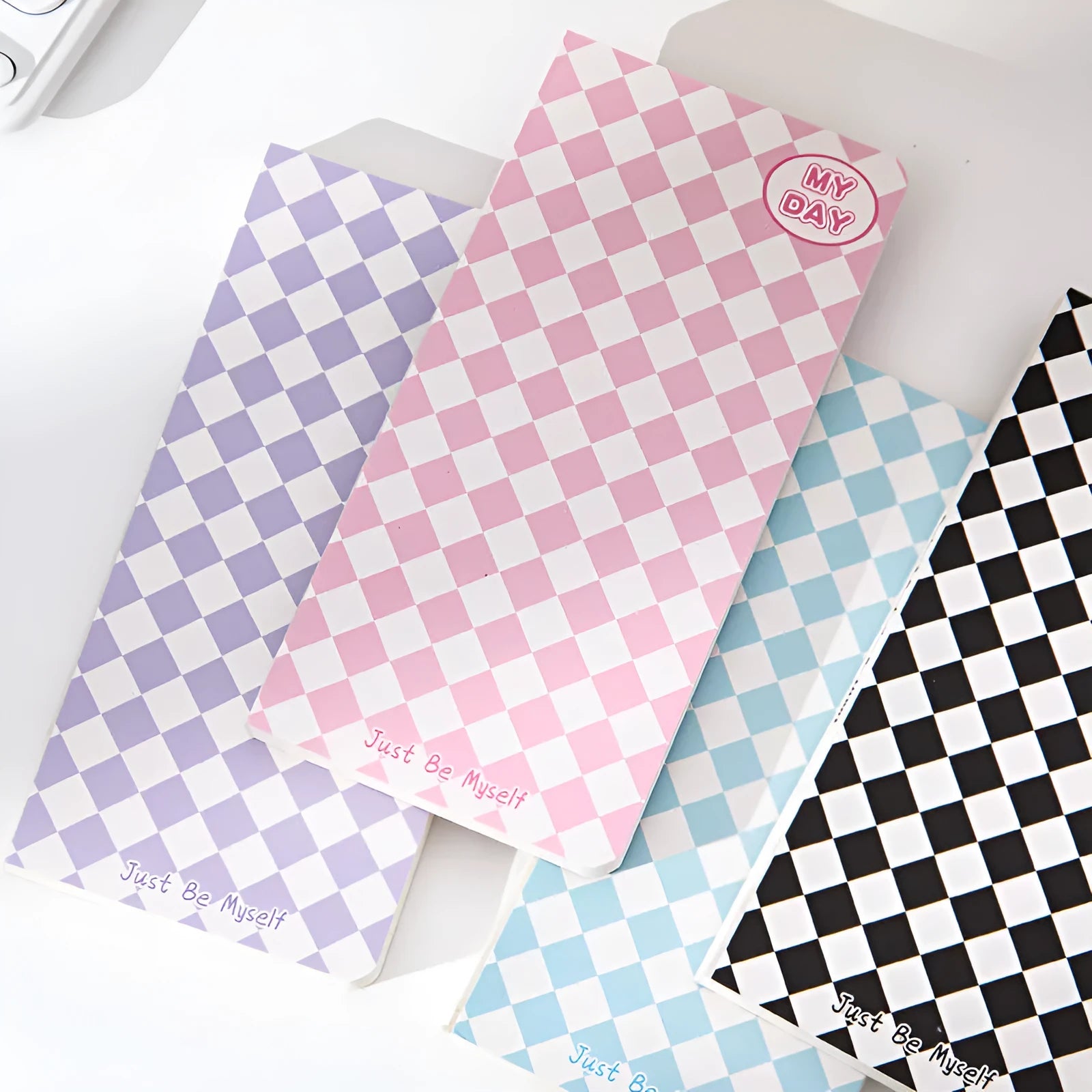 Japanese Korean cute style grid notebook with a colourful embossed fruit design cover, showing 100 sheets inside.