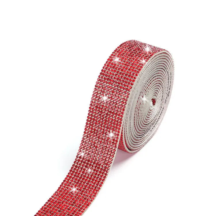 Self-adhesive water drill strip for clothing decoration in white and AB colour on a fabric background.