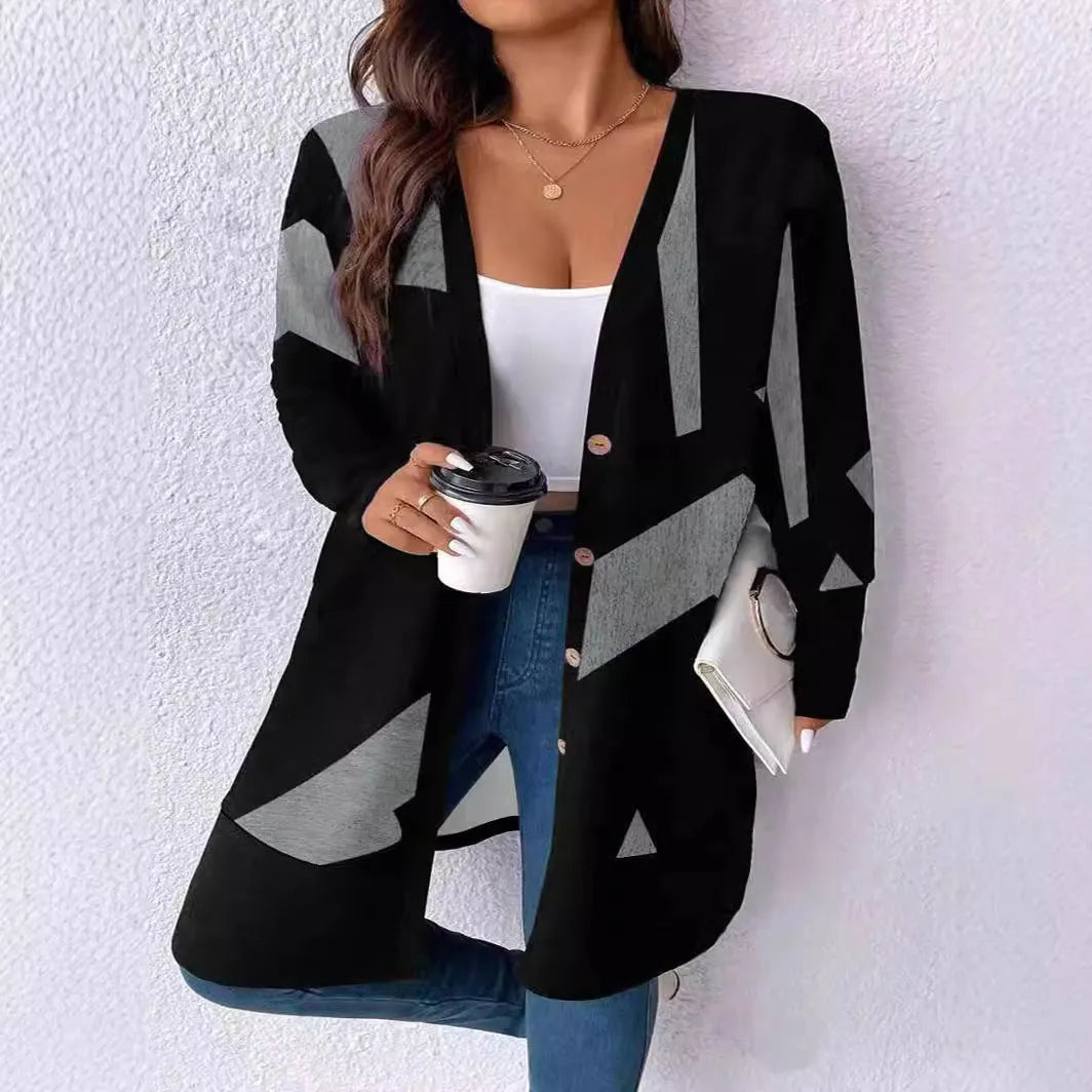 Black loose fit knit cardigan coat with button front on a hanger.