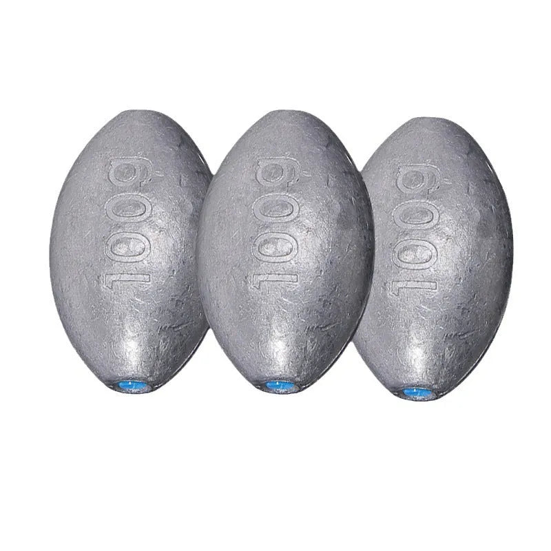 Close-up of a rugby-shaped olive lead fishing sinker with a Tongxin scale pattern texture.