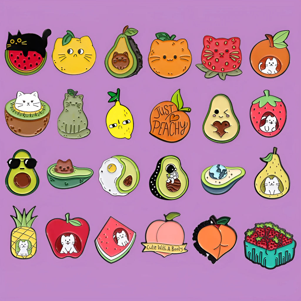 Colourful cartoon fruit shaped into a letter on a metal brooch with pin clasp.