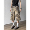 Yellow snake pattern camouflage cropped jeans on a denim background