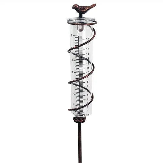 Cast iron stand with glass tube rain gauge featuring bird decoration and 1-20 measurement scale.