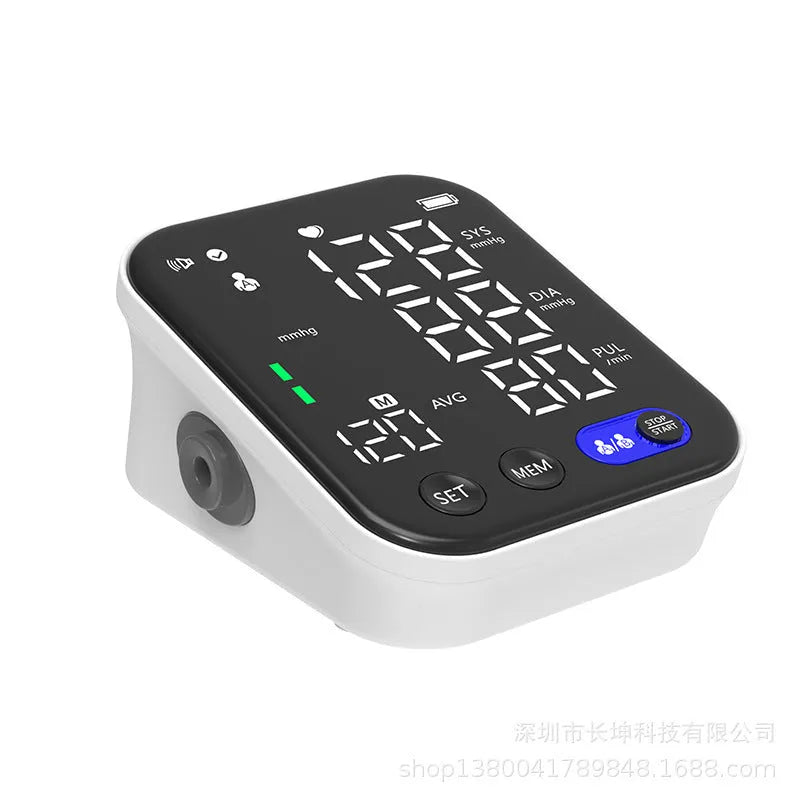 White electronic blood pressure monitor with large screen showing blood pressure and pulse readings