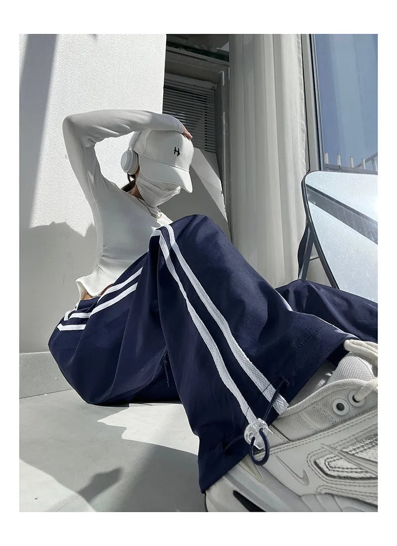 Women's navy blue trousers with white contrast ribbon parallel bar detailing, low-waist straight-leg design
