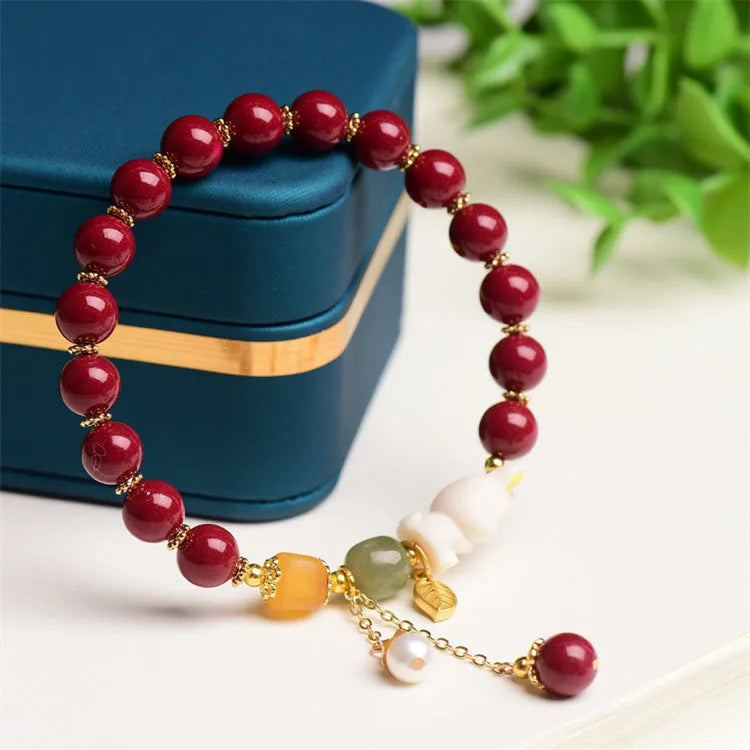 Natural cinnabar bracelet for women in purple-gold sand with rabbit motif, showing 8mm and 10mm bead size options.