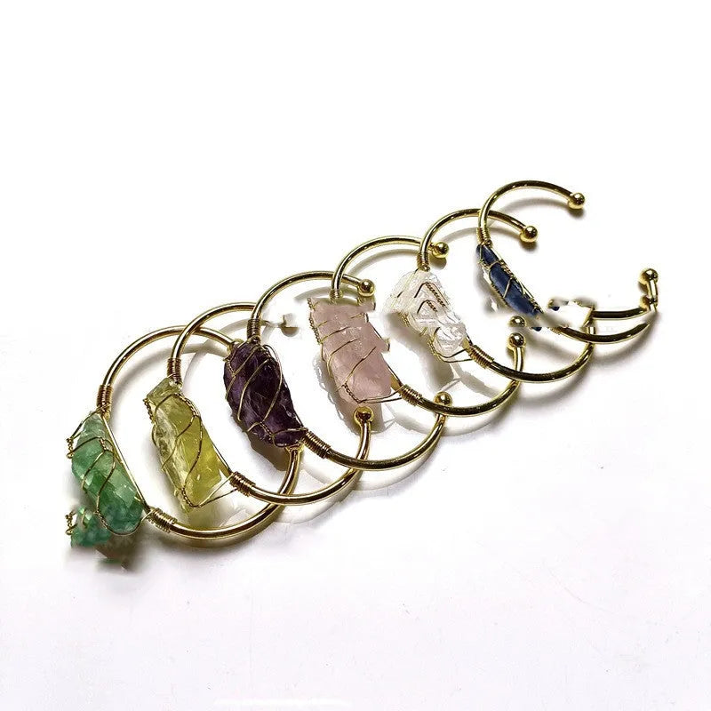 Natural crystal rough stone bracelet with gold metal winding in a geometric bohemian design