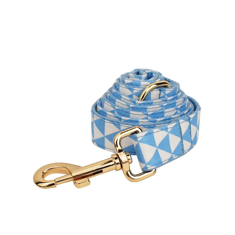 Blue cloth dog collar, leash, vest, and bow four-piece pet accessory set