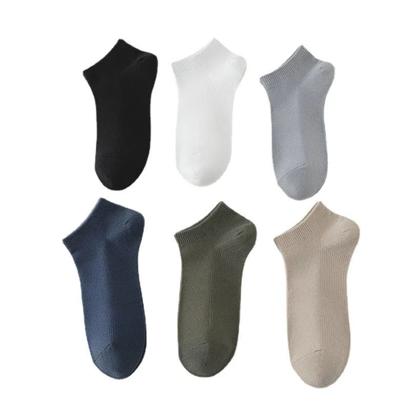 A pair of solid colour low-cut polyester boat socks laid flat.