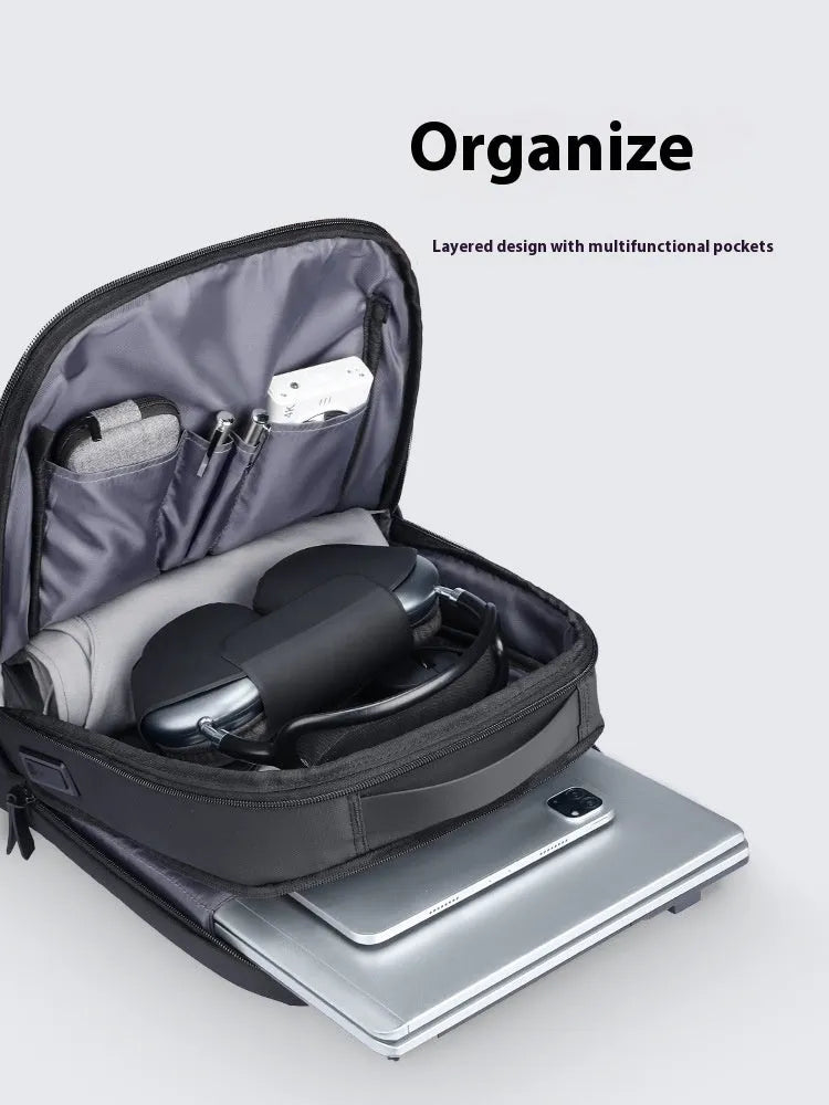 Graphite grey Oxford cloth USB charging business backpack with sewn details.