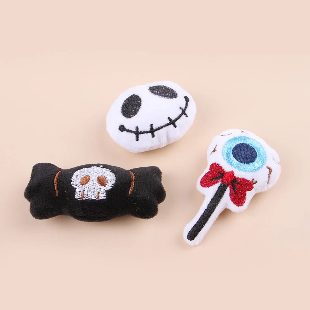 Small plush cat teaser toy with feather wand attachment in candy design