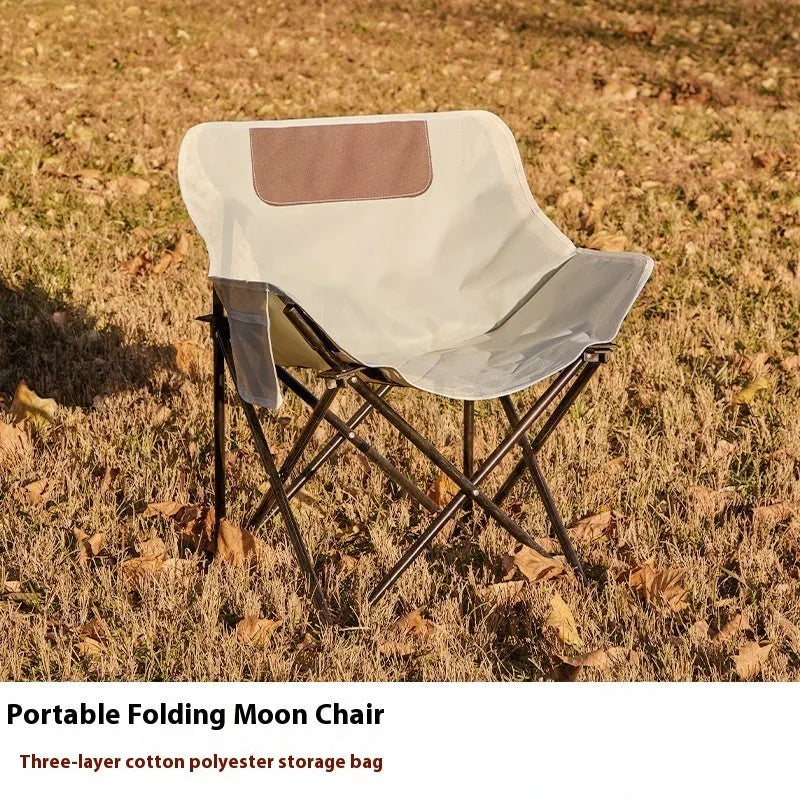 Portable folding recliner chair with steel frame and Oxford cloth seat in an outdoor setting.