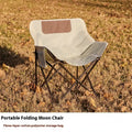 Portable folding recliner chair with steel frame and Oxford cloth seat in an outdoor setting.