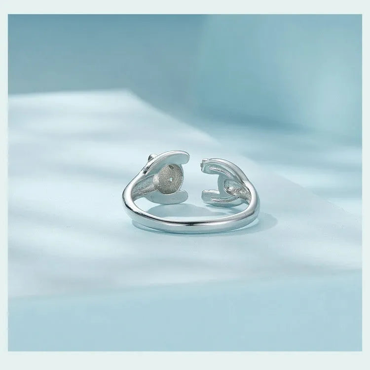 Adjustable sterling silver panda open ring with white gold plating, showing animal design and opening mechanism