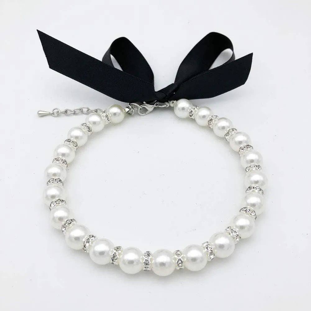 Adjustable dog necklace with imitation pearls, rhinestones, and ribbon bow for small pets