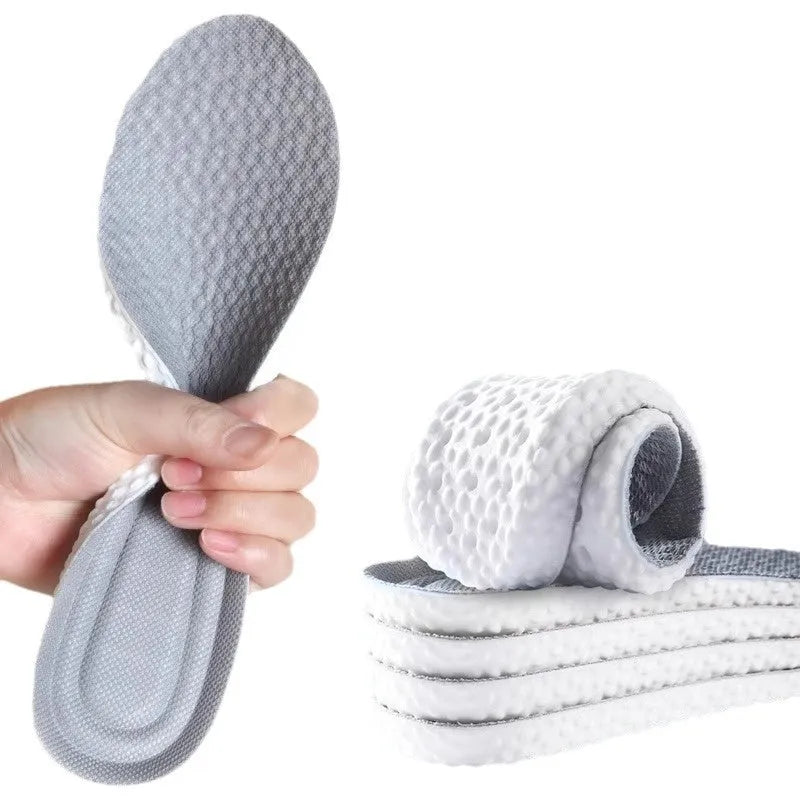 A pair of grey breathable PU sports insoles that can be cut to size on a white background