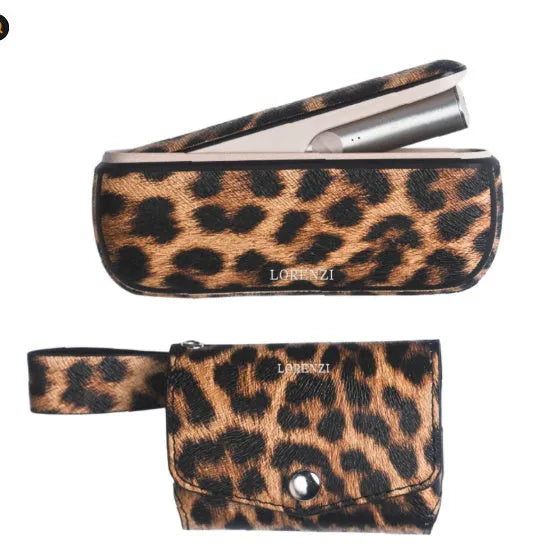 Yellow PU leather storage bag with a zip and handle next to makeup and jewellery.