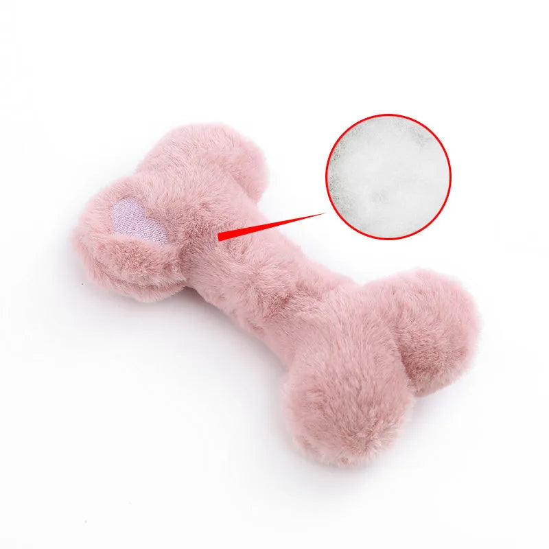 Vocal bone plush dog toy for aggressive chewers in blue, pink and yellow colours with internal squeaker
