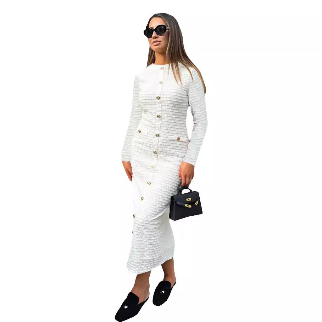 Black and white French retro slim fit knitted long-sleeved dress with button details.