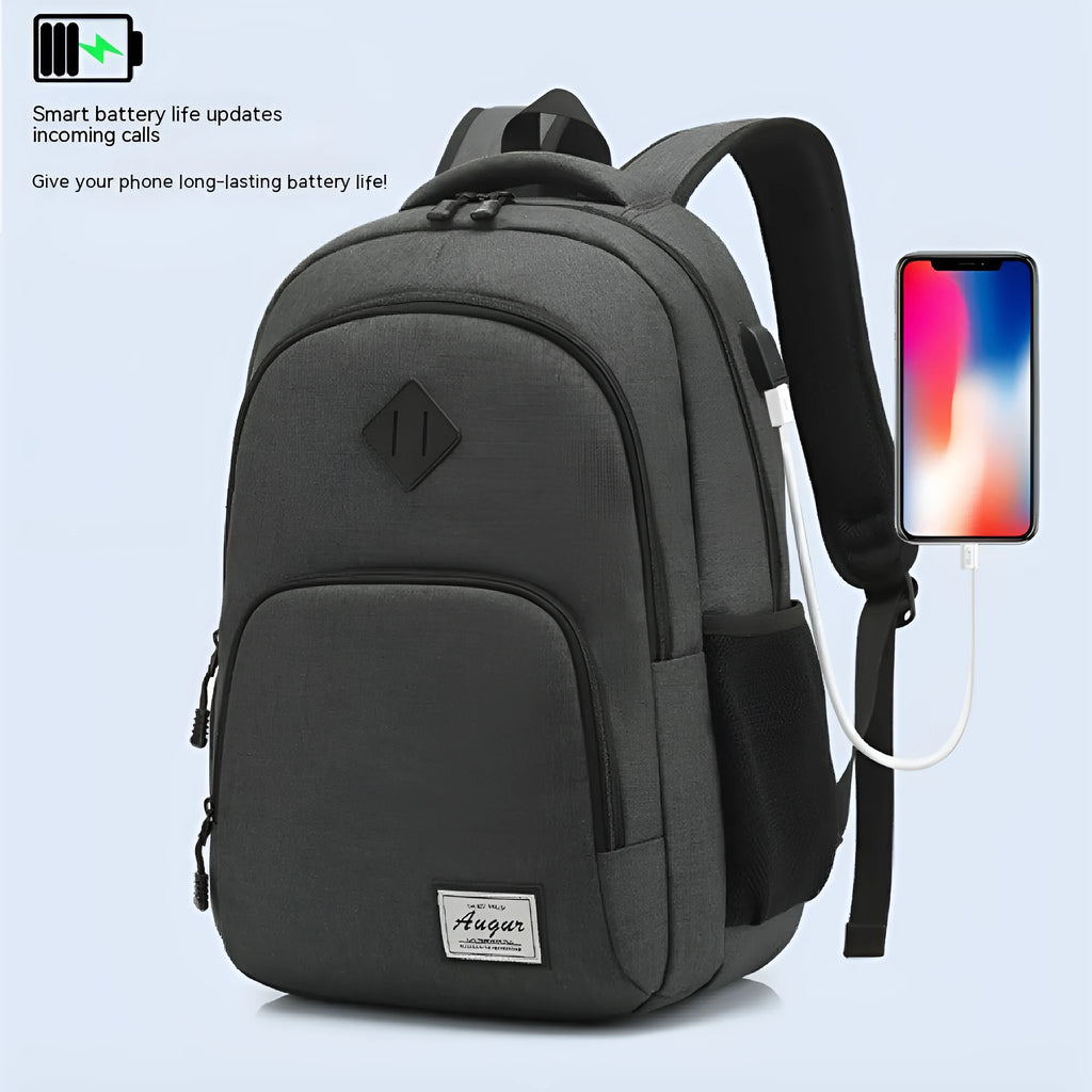 Grey nylon backpack with USB charging port and trolley strap on luggage
