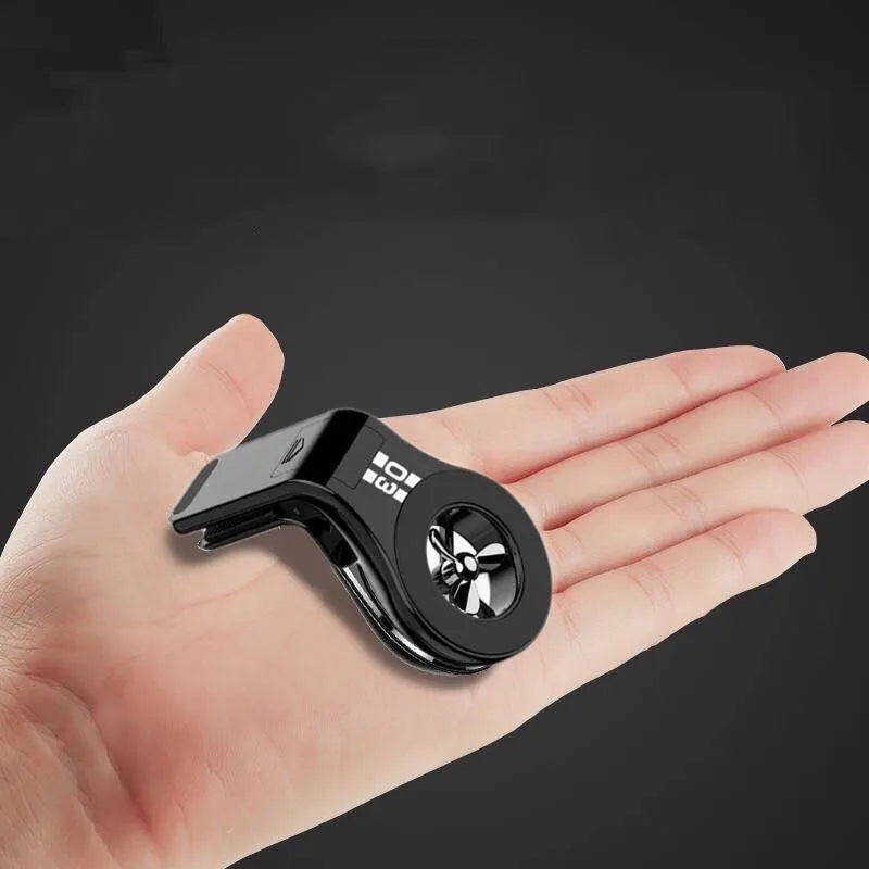 Black magnetic car air vent phone holder with adjustable mount and fragrance slice compartment.