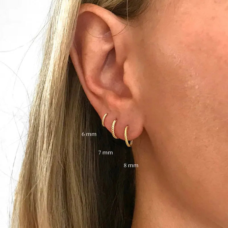 S925 sterling silver twisted string round ring stud earrings in gold and white gold finishes.