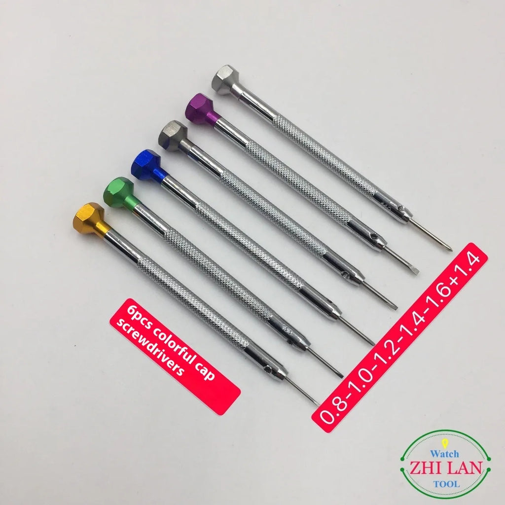 Six colour-coded watch repair screwdrivers with copper handles in an aluminium case.