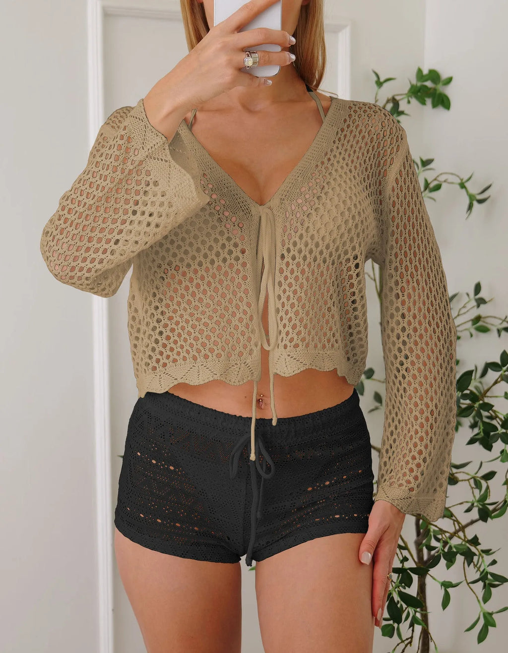 Women's hollow woven cardigan blouse with bell sleeves in apricot colour showing texture detail