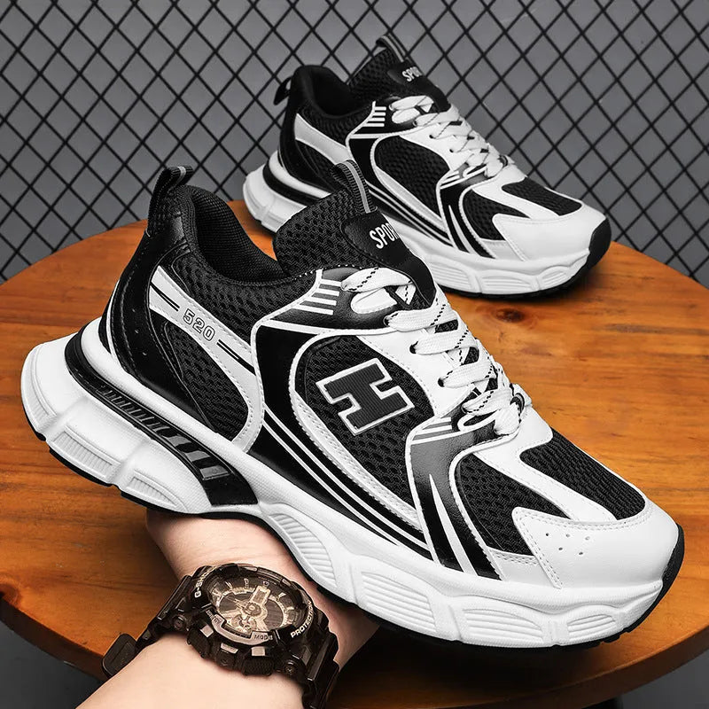 Men's mesh running shoes with plastic sole in black, white and grey, and white orange colour options
