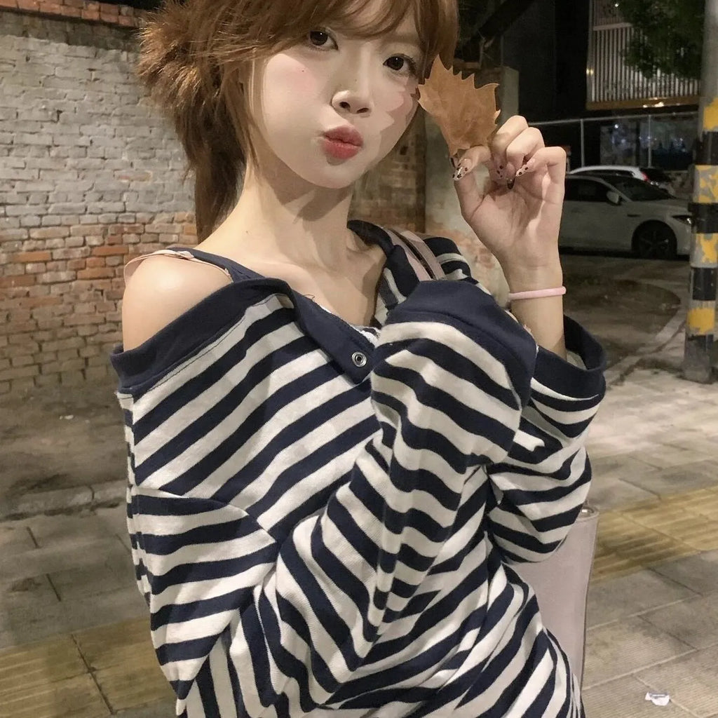 Dark blue Korean-style oversized women's long-sleeve t-shirt with stripe and embroidery detail.