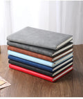 A5 notebook with PU leather cover in one of six colour options, showing wood-free paper inside.