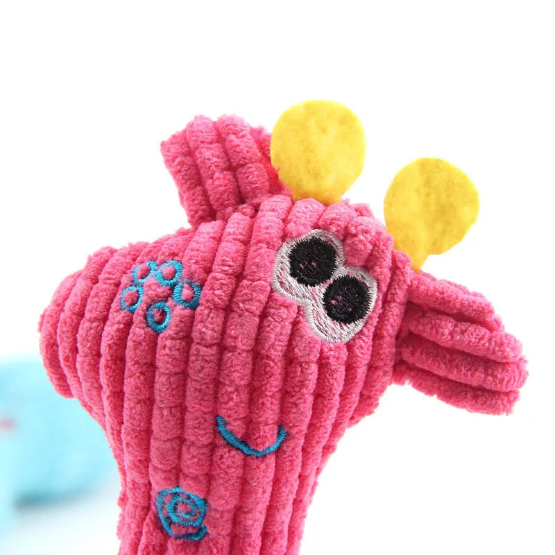 Blue deer shaped plush dog toy with corn grain texture, shown with a dog.