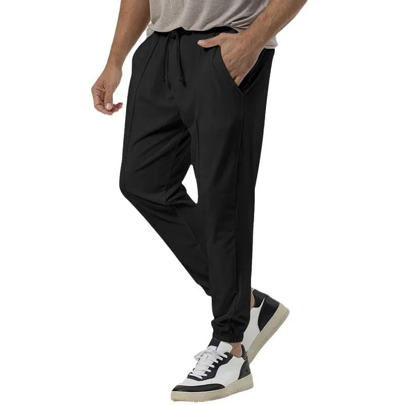 Men's casual track sweatpants in straight-leg tapered design with cotton blend fabric