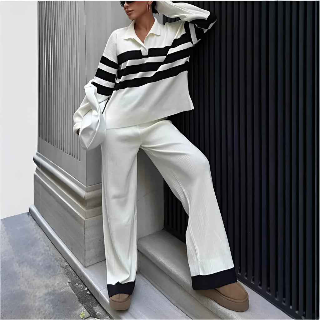 Women wearing black and white striped polo collar two-piece set with matching trousers