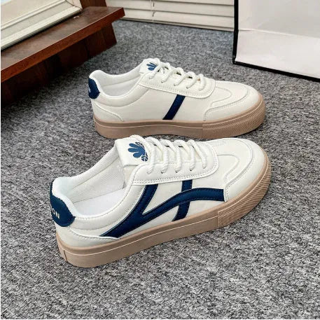 Blue and brown low-top casual board shoes with round toe and flat rubber sole.