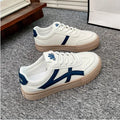Blue and brown low-top casual board shoes with round toe and flat rubber sole.