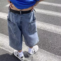 Men's blue washed denim pirate shorts with a cropped length, high waist, and straight leg cut.