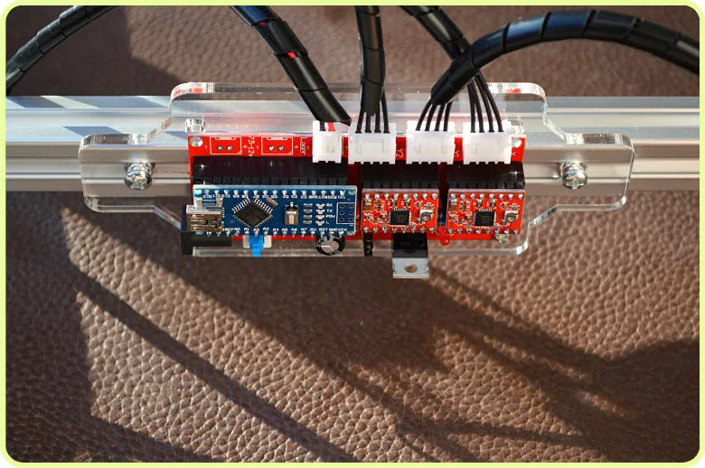 Miniature 3000mw laser engraving machine with a 400mm by 300mm base plate.