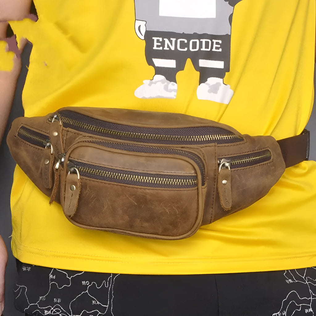 Brown leather retro messenger bag with a single shoulder strap shown open.