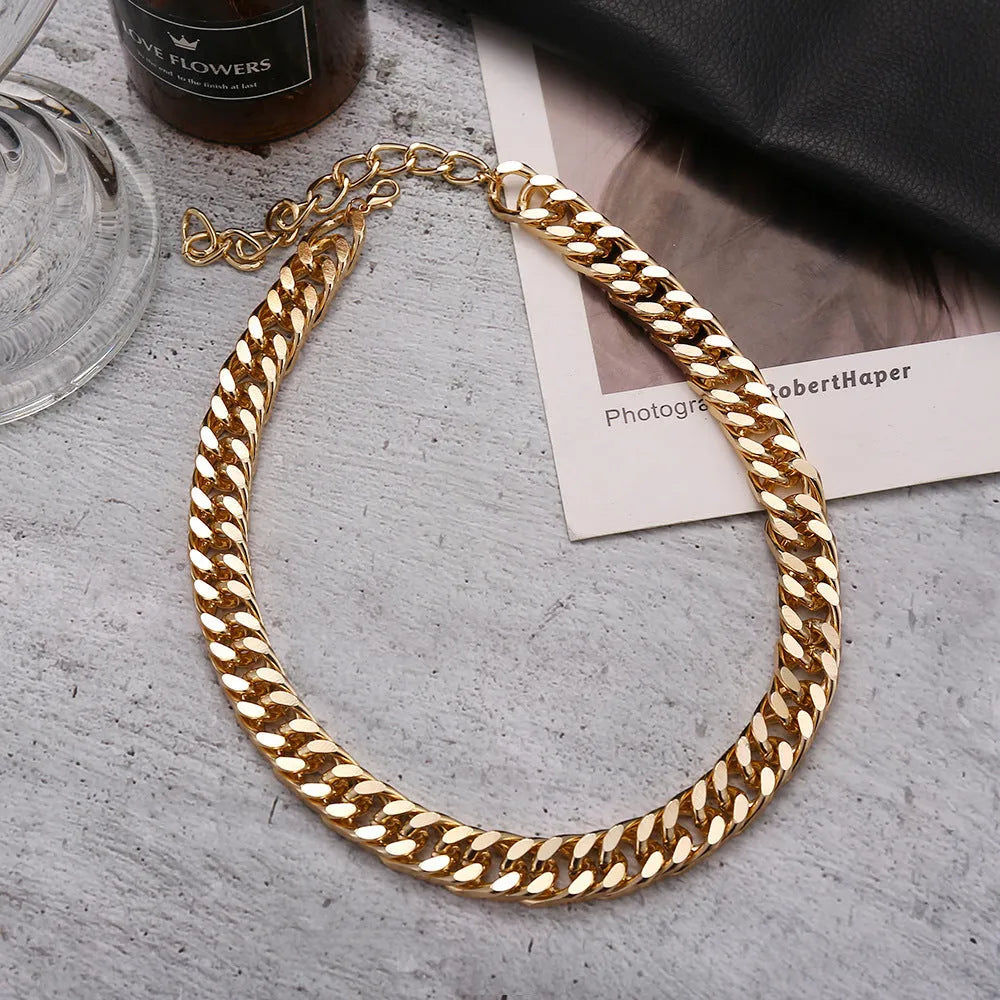 Women's thick gold chain necklace showing 32cm length with electroplated finish and simple solid colour design