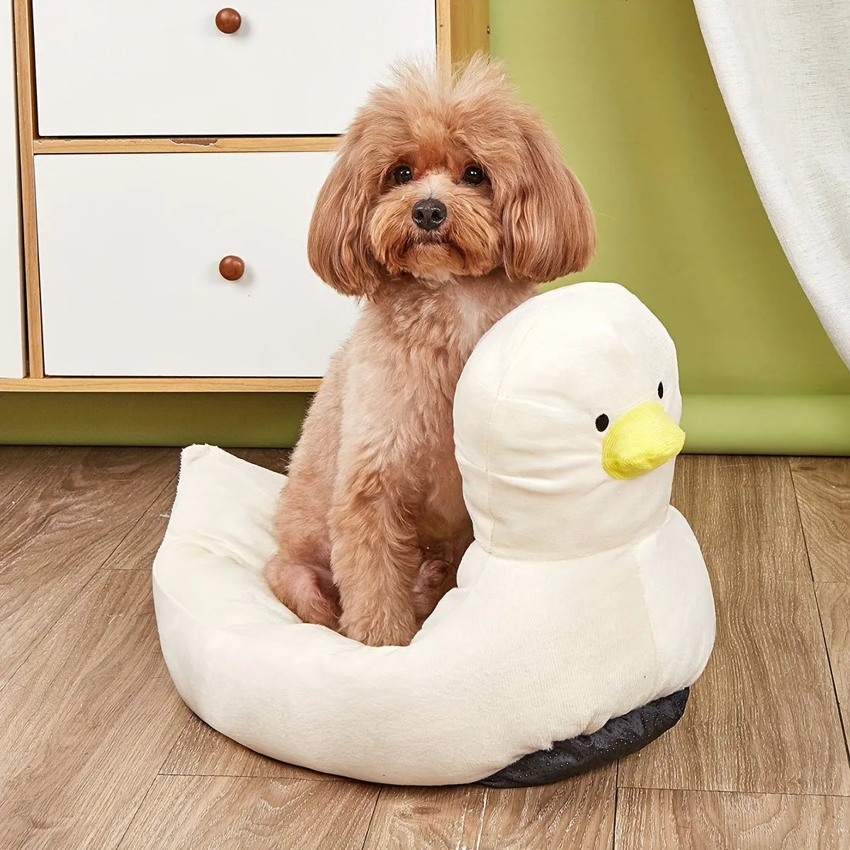 Blue duck-shaped fluffy pet bed sofa for small dogs and cats on a wooden floor.