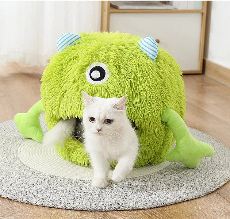 A round fluffy pet bed for cats and small dogs on a wooden floor.