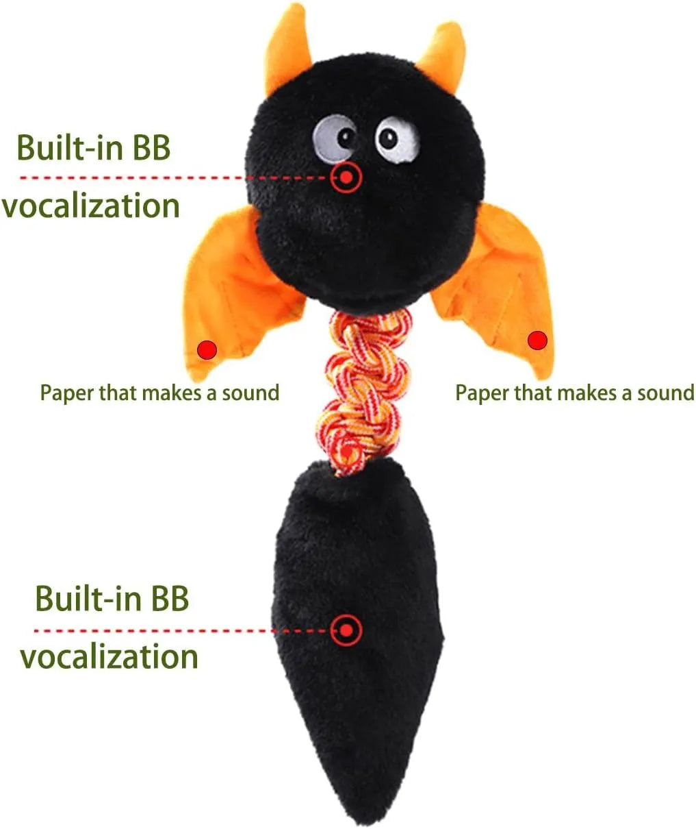 Large green plush dog toy with rope knot and cartoon design on a white background.