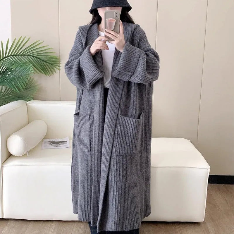 Women's loose-fitting hooded cardigan coat in acrylic fibre, shown in a neutral colour.